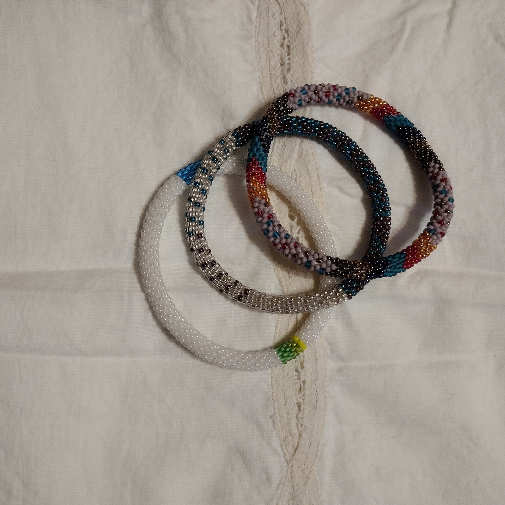 A set of 3 roll on beaded bracelets.